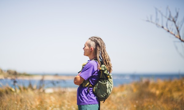 MW Woman with dreads in sand dune.jpg